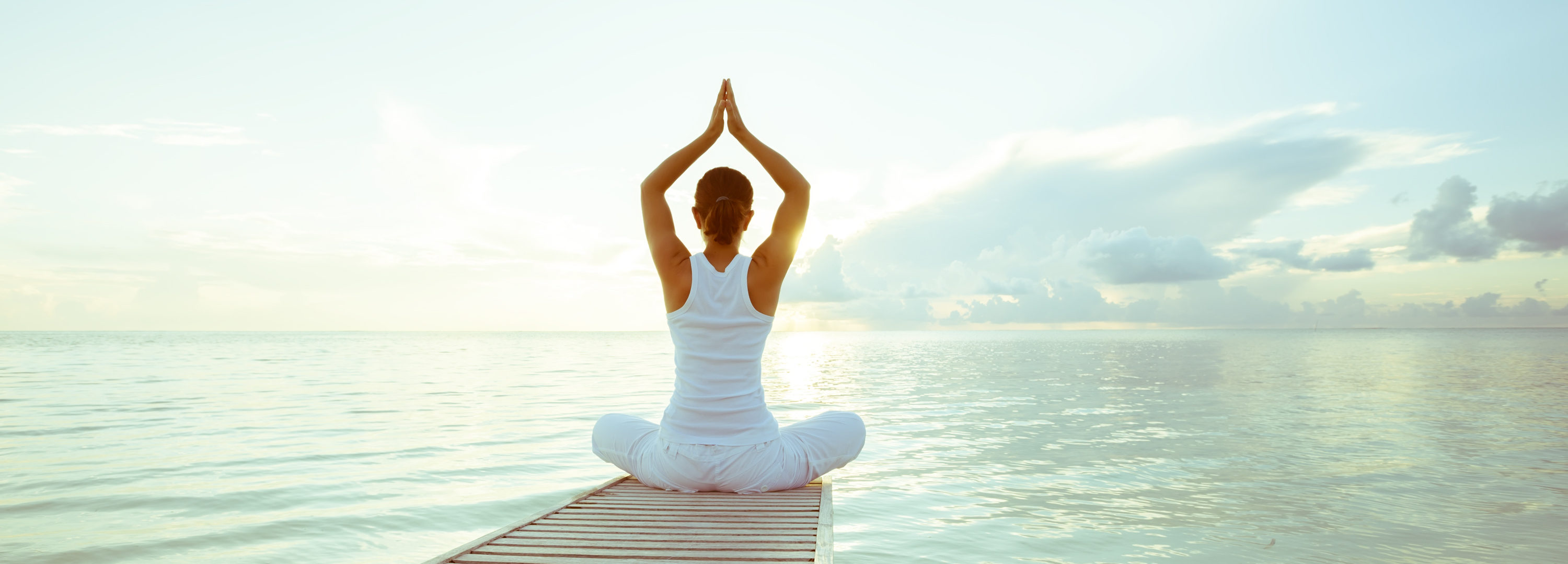 practicing yoga at seashore