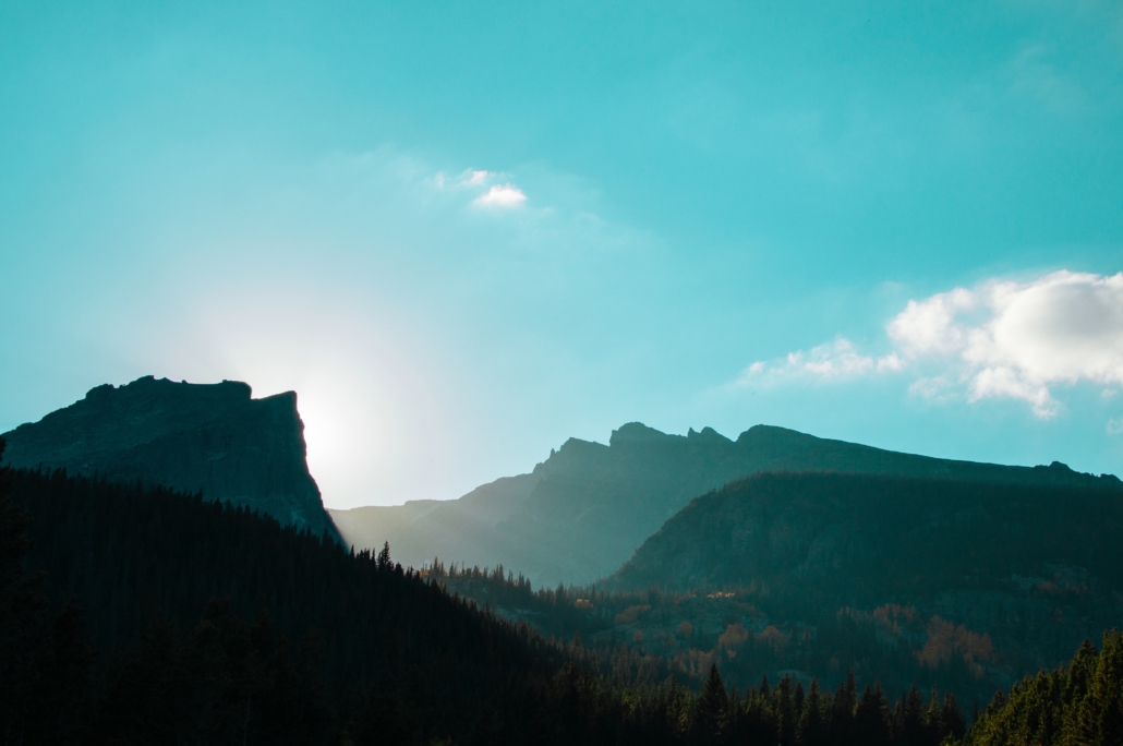 light peaking out between two mountains