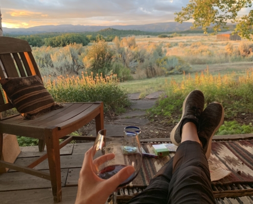 glass of wine and sitting outside in durango colorado