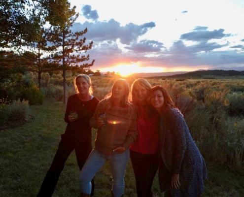 girl group photo at sunset