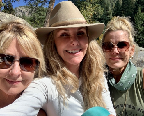 3 beautiful women smiling on their colorado hike